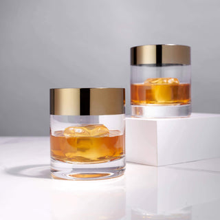 Irving Bronze-Rimmed Crystal Lowball Tumblers set of 2 with whiskey and ice, showcasing mid-century modern design.