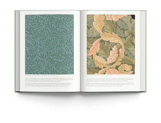 Open book featuring wallpaper designs by William Morris, showcasing detailed patterns in elegant colors.