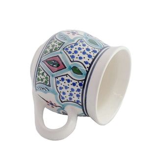 Hand-painted Amira mug with vibrant geometric design, uniquely crafted stoneware, elegant addition to any collection.