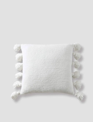 Soft white pom pom throw pillow with cozy microfiber cover and plush pom pom accents on the edges, OEKO-TEX® certified.