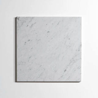 Venatino Carrara 4x4 tumbled marble tile showcasing elegant white and gray veining, perfect for stylish flooring and accent walls.