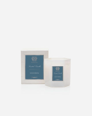 Santorini Candle in soft white glass with hexagonal design, packaged elegantly for cozy ambiance and lasting fragrance.