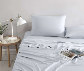 Natural premium bamboo sheet set in light blue, featuring silky-soft fitted sheet and pillowcases for a sustainable bedroom.