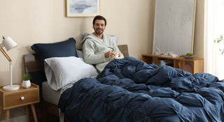 Man relaxing in bed with Premium Bamboo Bubble Comforter and shams, enjoying comfort and style in a cozy bedroom.