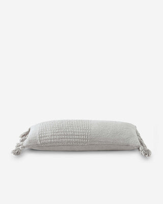 Braided Pom Pom Lumbar Pillow in soft grey with decorative pom poms and textured cover, OEKO-TEX® certified.