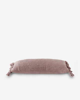 Braided pom pom lumbar pillow in soft beige, featuring memory foam and removable cover. OEKO-TEX® certified.
