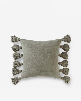 Soft green pom pom throw pillow with fluffy tassels on edges, perfect for home decor and comfort.