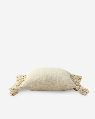 Soft memory-foam pom pom throw pillow with fuzzy tassels in beige, OEKO-TEX® certified for comfort and style.