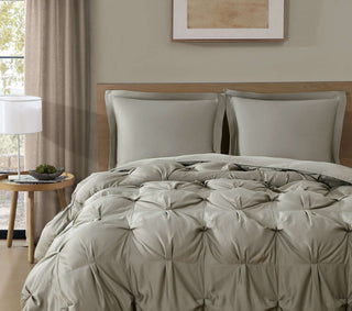 Premium Bamboo Bubble Comforter Bundle with shams on a bed, showcasing a soft and cozy design in a serene bedroom setting.