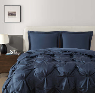 Premium Bamboo Bubble Comforter Bundle in navy blue with matching shams on a bed, showcasing cozy and stylish bedding.