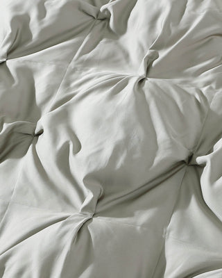 Close-up of a soft, breathable bamboo comforter with a luxurious, puffy texture for ultimate coziness.