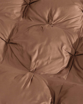 Close-up of a Premium Bamboo Bubble Comforter in rich brown, highlighting its soft, silky texture and tufted design.