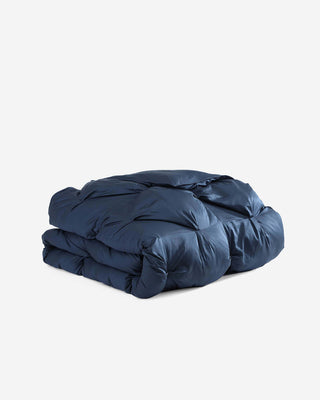 Premium bamboo bubble comforter bundle in deep navy color, perfect for cozy, breathable bedding all year round.