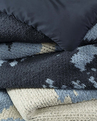 Close-up of the Double Snug Pixel Comforter showcasing its plush texture and multi-tone colors for added warmth.