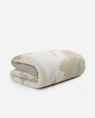 Double Snug Pixel Comforter folded, featuring multi-tone colors and plush recycled filling for warmth.