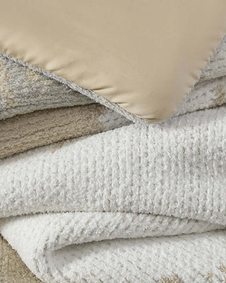 Close-up of the Double Snug Pixel Comforter showing its plush layers and cozy textures for ultimate warmth.