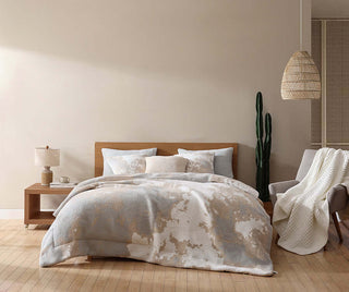 Double Snug Pixel Comforter on bed with modern decor, warm hues, and stylish accessories for cozy bedroom aesthetics.