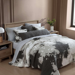 Double Snug Pixel Comforter in modern multi-tone design, layered on a cozy bed with decorative pillows.