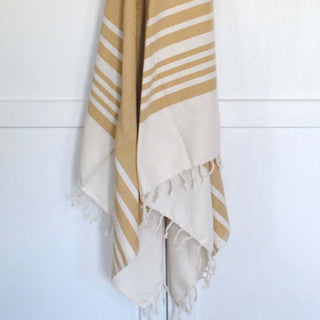 Beige bath towel set of 2 with hand twisted tassels, made from organic cotton, perfect for home or beach use.