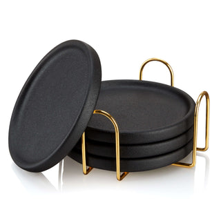 Set of 4 sleek black earthenware coasters with gold metal holder for stylish home decor.
