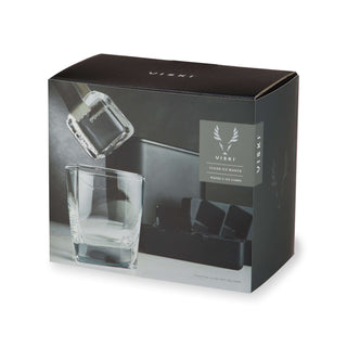 Glacier Rocks clear ice maker packaging showcasing crystal-clear ice cubes and elegant glassware for cocktails.