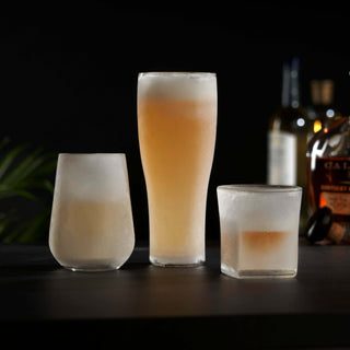 Glacier Double-Walled Chilling Whiskey Glass set with cooling gel, showcasing three elegant drinkware designs.