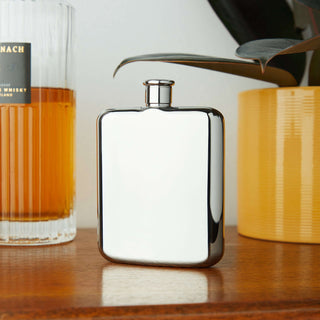 Harrison Flask: polished stainless steel 6 oz capacity flask with shiny cap, perfect for carrying liquor.
